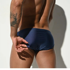 a sexy man in midnight blue Men’s Pool Plumper Padded Swim Briefs - pridevoyageshop.com - gay men’s sexy swim briefs, trunks, board shorts, and bikinis
