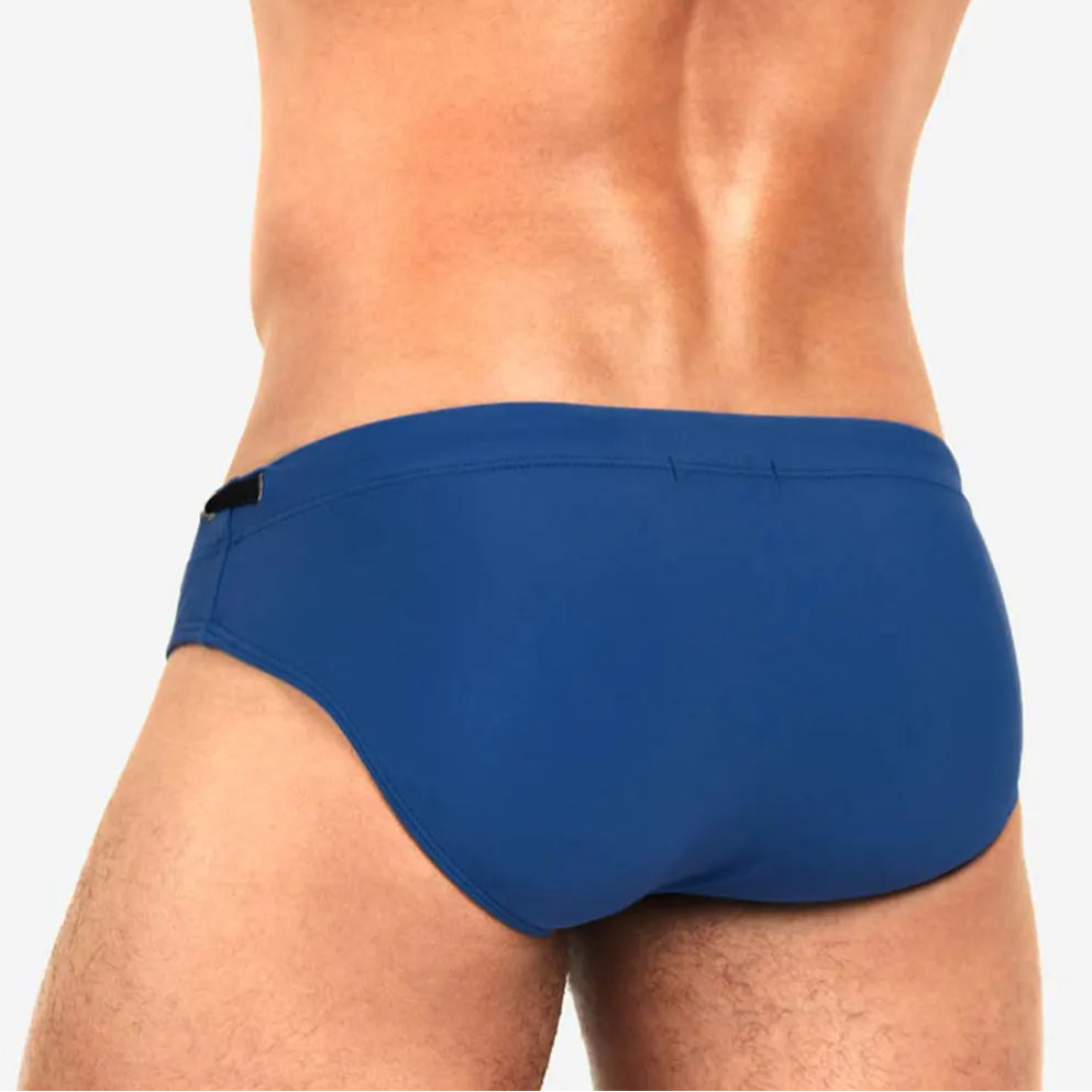 a sexy man in navy Men’s Beach Brat Swim Briefs - pridevoyageshop.com - gay men’s sexy swim briefs, trunks, board shorts, and bikinis