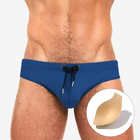a sexy man in navy Men’s Beach Brat Swim Briefs with pad - pridevoyageshop.com - gay men’s sexy swim briefs, trunks, board shorts, and bikinis