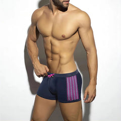a sexy man in navy Men’s Circuit Spark Low Rise Swim Trunks - pridevoyageshop.com - gay men’s sexy swim briefs, trunks, board shorts, and bikinis