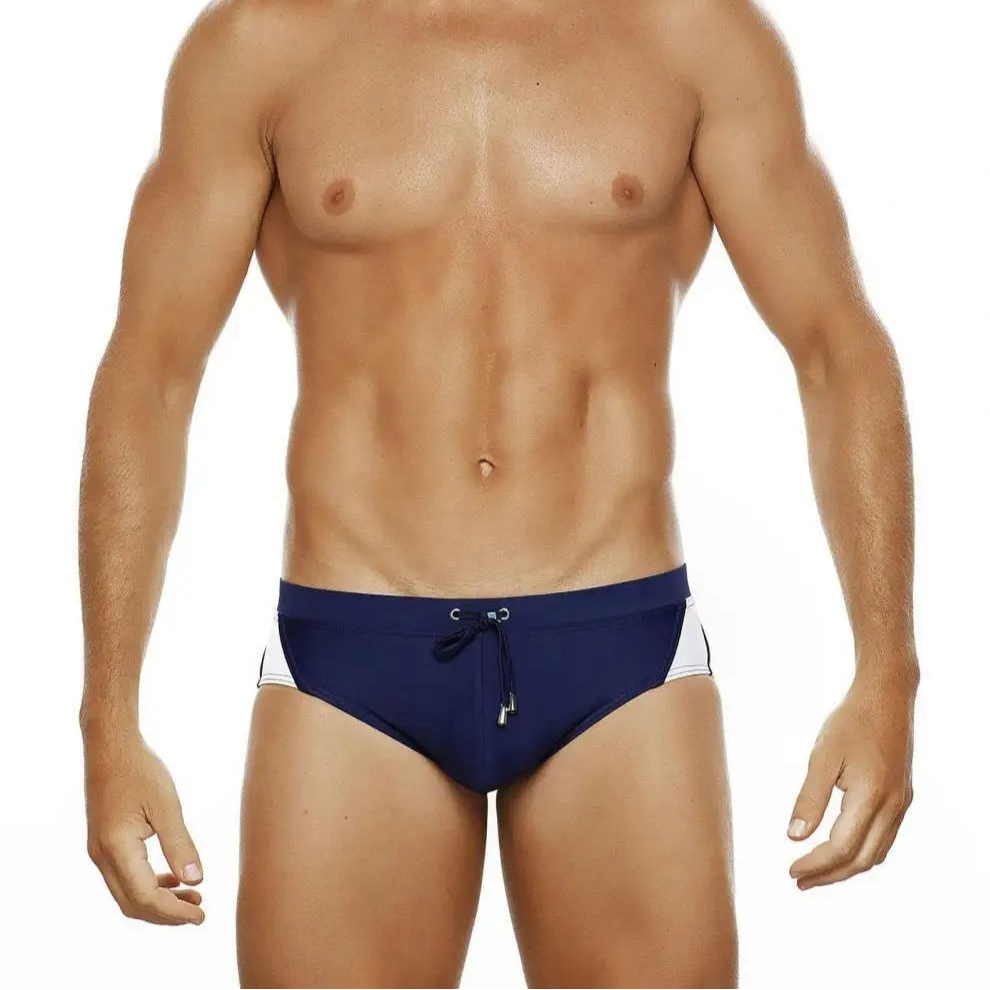 a sexy man in navy blue Men’s Backdoor Varsity Swim Briefs - pridevoyageshop.com - gay men’s sexy swim briefs, trunks, board shorts, and bikinis