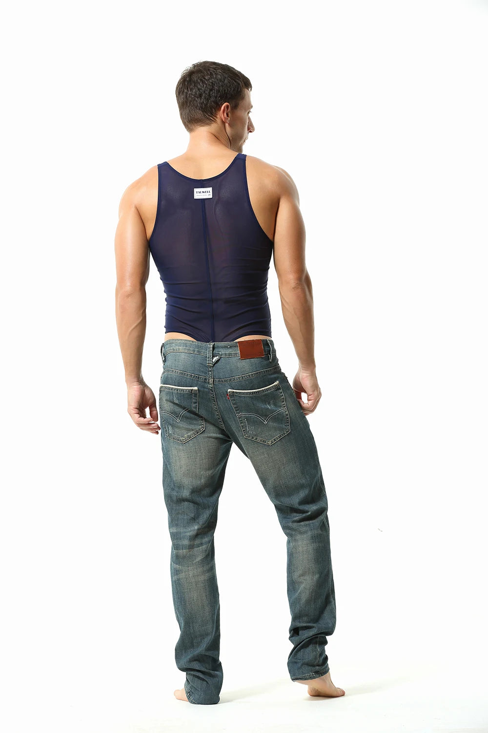 a sexy man in navy blue The Preview Sheer Bodysuit – pridevoyageshop.com – gay men’s harness, lingerie and fetish wear