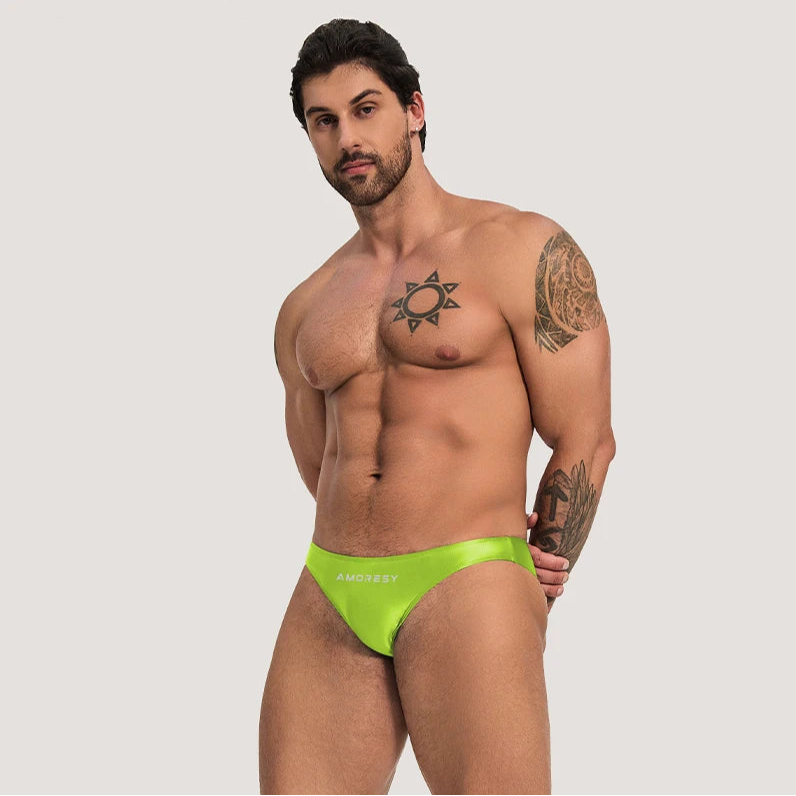 a sexy man in neon green Men’s Shiny Lube Job Mini Swim Briefs - pridevoyageshop.com - gay men’s sexy swim briefs, trunks, board shorts, and bikinis