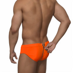 a sexy man in neon orange Men's Unzip Me Daddy Swim Briefs - pridevoyageshop.com - gay men’s sexy swim briefs, trunks, board shorts, and bikinis