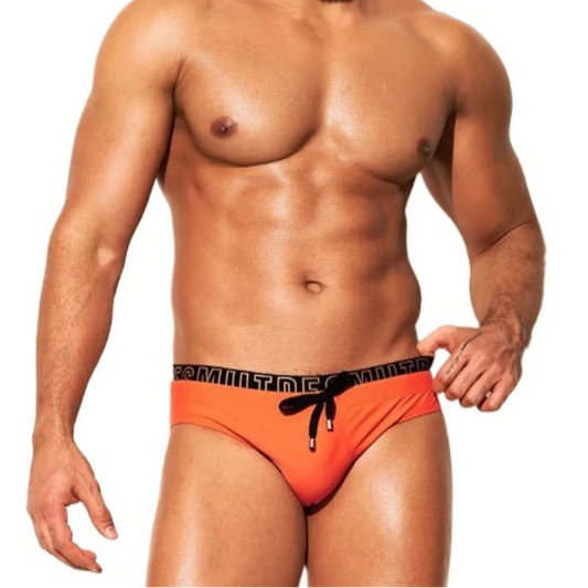 a sexy man in orange Desmiit Men's Wet Agenda Swim Briefs - pridevoyageshop.com - gay men’s sexy swim briefs, trunks, board shorts, and bikinis