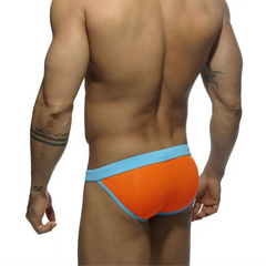 a sexy man in orange Men’s Forbidden Fruit Bikini Swim Briefs - pridevoyageshop.com - gay men’s sexy swim briefs, trunks, board shorts, and bikinis