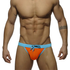 a sexy man in orange Men’s Forbidden Fruit Bikini Swim Briefs - pridevoyageshop.com - gay men’s sexy swim briefs, trunks, board shorts, and bikinis