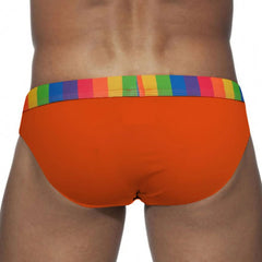 a sexy man in orange Men’s Pride Patrol Rainbow Band Swim Briefs - pridevoyageshop.com - gay men’s sexy swim briefs, trunks, board shorts, and bikinis