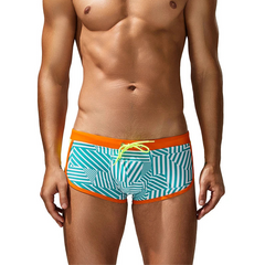 a sexy man in orange side SEOBEAN Men’s Obey the Stripe Low Rise Swim Trunks – pridevoyageshop.com – gay men’s sexy swim briefs, trunks, board shorts, and bikinis