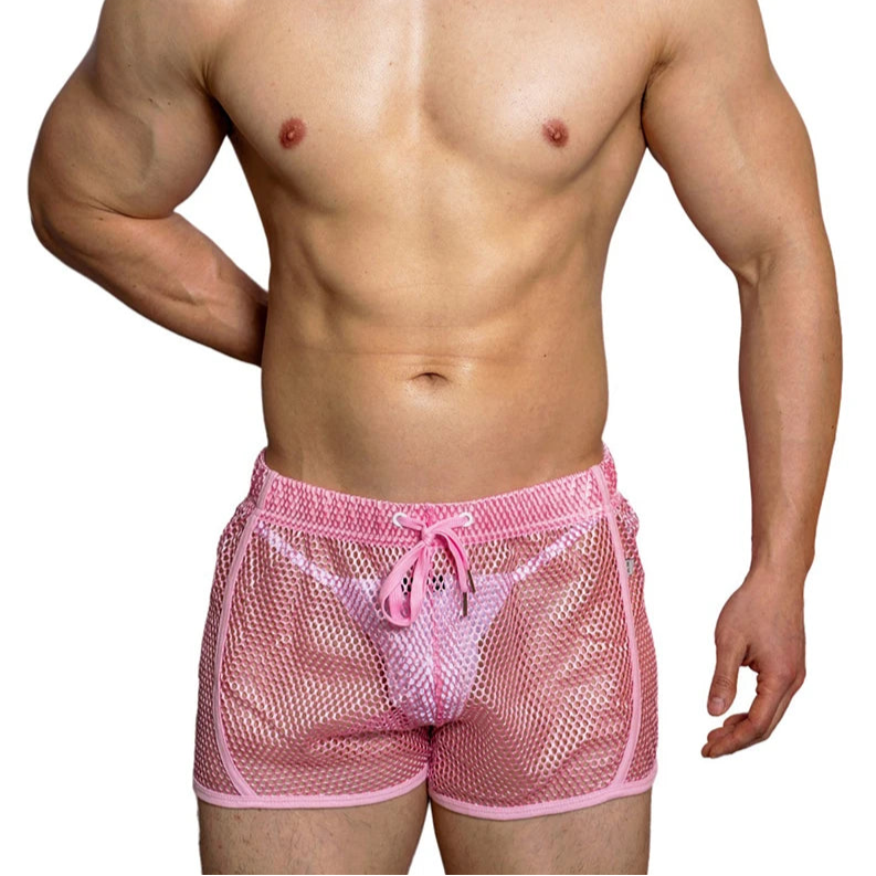 a sexy man in pink DM Men’s Trade Bait See-Thru Mesh Shorts – pridevoyageshop.com – gay men’s sexy swim briefs, trunks, board shorts, and bikinis