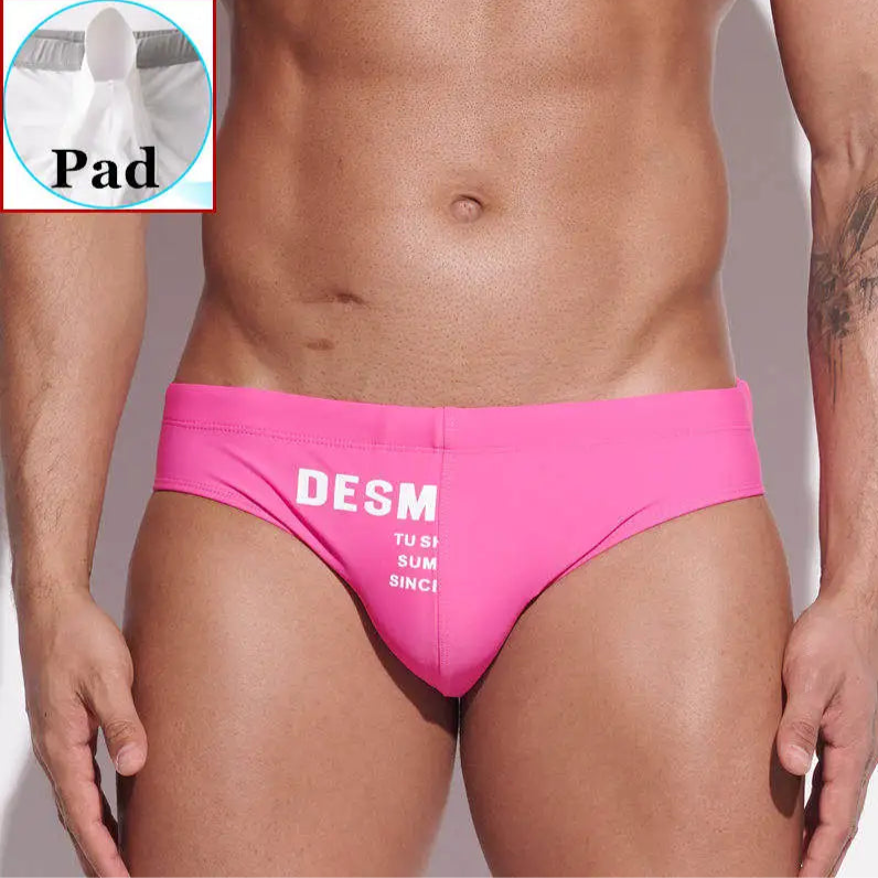 a sexy man in pink Men’s MVP Meatpack Swim Briefs with pad - pridevoyageshop.com - gay men’s sexy swim briefs, trunks, board shorts, and bikinis