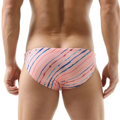 a sexy man in pink Men’s Rainbow Ripple Pride Swim Briefs - pridevoyageshop.com - gay men’s sexy swim briefs, trunks, board shorts, and bikinis