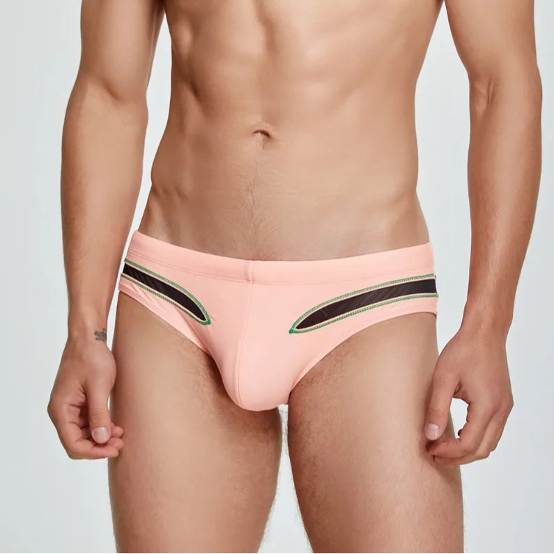 a sexy man in pink Men’s Slit & Sizzle Mesh Eyes Swim Briefs - pridevoyageshop.com - gay men’s sexy swim briefs, trunks, board shorts, and bikinis