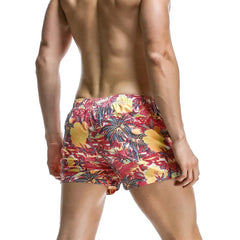a sexy man in pink Men’s Tap-Ready Tides Swim Beach Surf Shorts – pridevoyageshop.com – gay men’s sexy swim briefs, trunks, board shorts, and bikinis