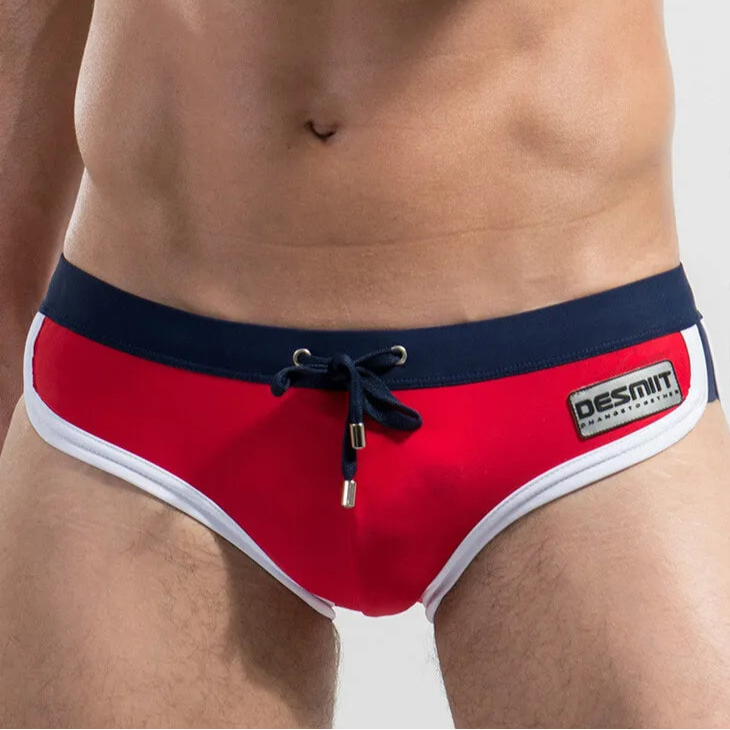 a sexy man in red Desmiit Men’s Colorblock Speed Bulge Swim Briefs - pridevoyageshop.com - gay men’s sexy swim briefs, trunks, board shorts, and bikinis

