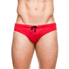 a sexy man in red Men’s Beach Brat Swim Briefs - pridevoyageshop.com - gay men’s sexy swim briefs, trunks, board shorts, and bikinis