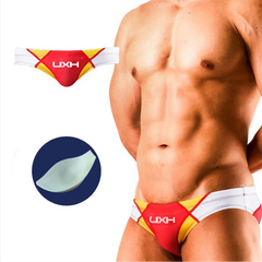 a sexy man in red Men’s Halftime Hard-On Swim Briefs with pad - pridevoyageshop.com - gay men’s sexy swim briefs, trunks, board shorts, and bikinis