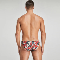a sexy man in red Men’s Prism Tease Swim Briefs - pridevoyageshop.com - gay men’s sexy swim briefs, trunks, board shorts, and bikinis