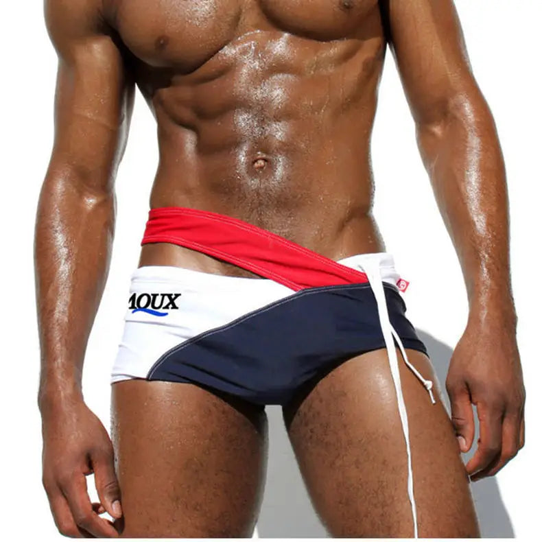 a sexy man in red Men’s Rebel Crossfire Low Rise Swim Briefs - pridevoyageshop.com - gay men’s sexy swim briefs, trunks, board shorts, and bikinis