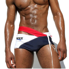 a sexy man in red Men’s Rebel Crossfire Low Rise Swim Briefs - pridevoyageshop.com - gay men’s sexy swim briefs, trunks, board shorts, and bikinis