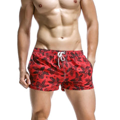a sexy man in red Men’s Tap-Ready Tides Swim Beach Surf Shorts – pridevoyageshop.com – gay men’s sexy swim briefs, trunks, board shorts, and bikinis