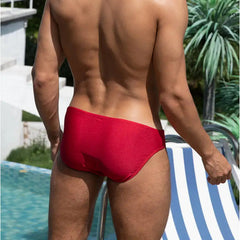 a sexy man in red Men’s Tease-Me Minimal Swim Briefs - pridevoyageshop.com - gay men’s sexy swim briefs, trunks, board shorts, and bikinis