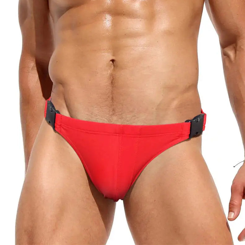 a sexy man in red Men’s Unclip Me Double Buckle Swim Briefs - pridevoyageshop.com - gay men’s sexy swim briefs, trunks, board shorts, and bikinis