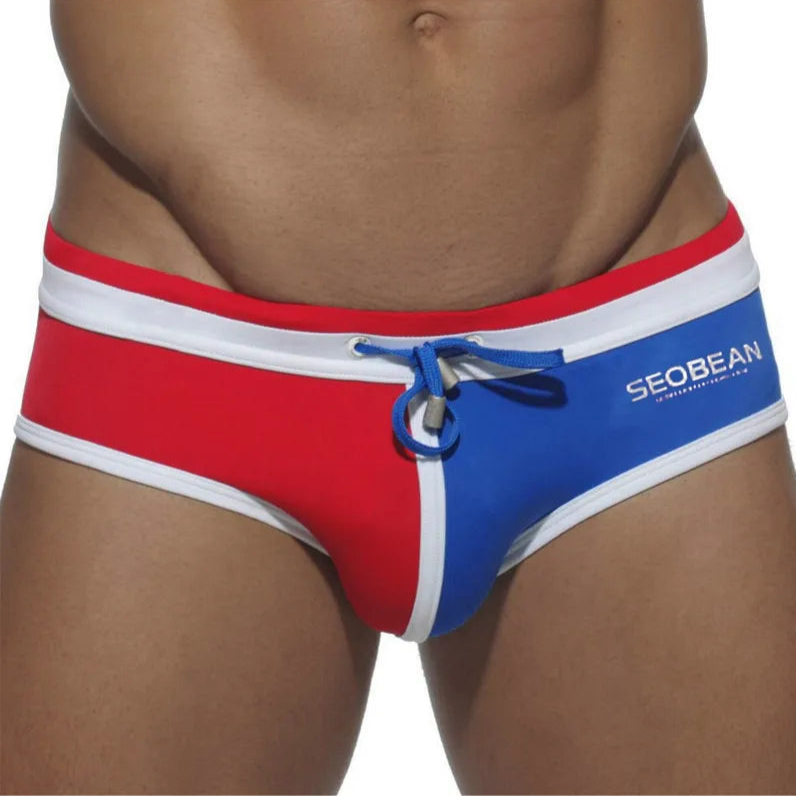 a sexy man in red and black Men’s Split Decision Bulge Swim Briefs - pridevoyageshop.com - gay men’s sexy swim briefs, trunks, board shorts, and bikinis