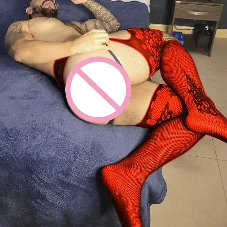 a sexy man in red g-string garter tights with sheer mesh garter legs hugging the thighs and showing booty cutout – pridevoyageshop.com – gay men’s harness, lingerie and fetish wear