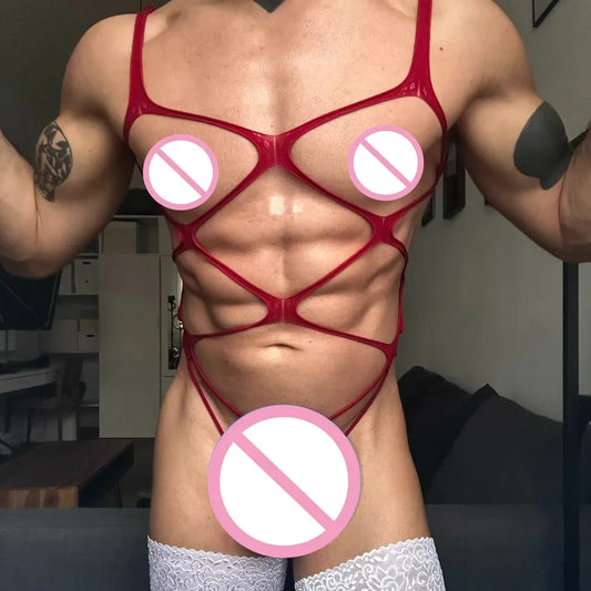 a sexy man in red web-mesh bodysuit, revealing torso, high-cut leg and sultry mesh straps – pridevoyageshop.com – gay men’s harness, lingerie and fetish wear
