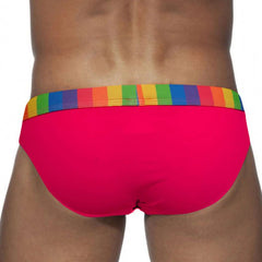 a sexy man in rose red Men’s Pride Patrol Rainbow Band Swim Briefs - pridevoyageshop.com - gay men’s sexy swim briefs, trunks, board shorts, and bikinis
