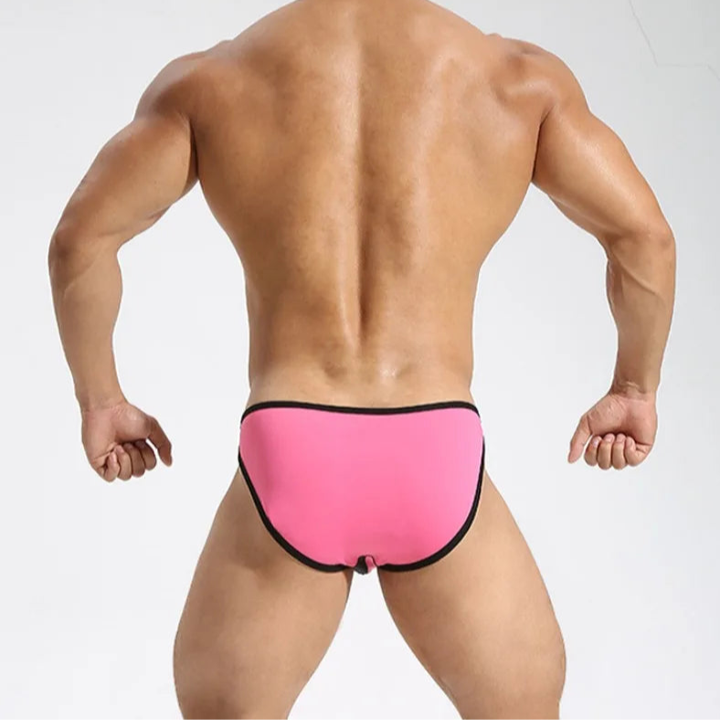 a sexy man in rose red Men’s Slick Split-Panel Swim Briefs - pridevoyageshop.com - gay men’s sexy swim briefs, trunks, board shorts, and bikinis