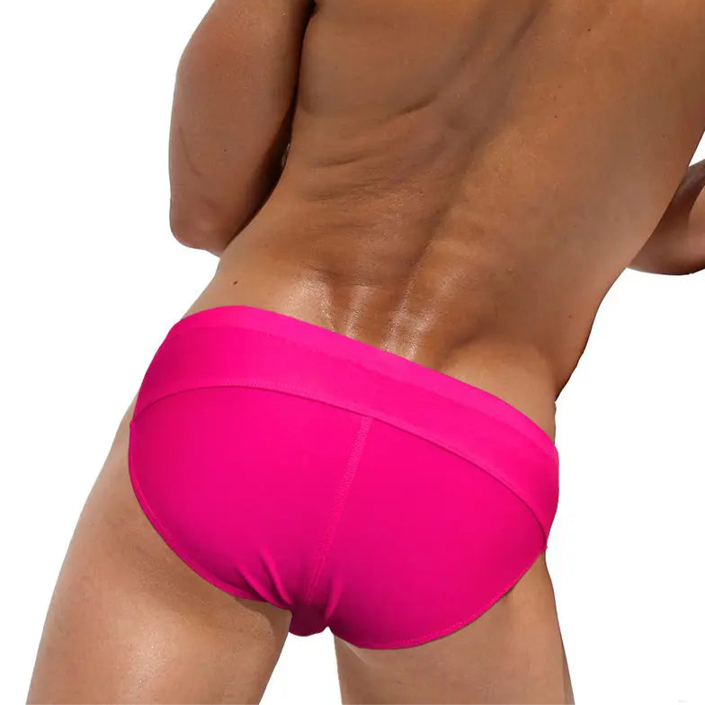 a sexy man in rose red Men’s Unclip Me Double Buckle Swim Briefs - pridevoyageshop.com - gay men’s sexy swim briefs, trunks, board shorts, and bikinis