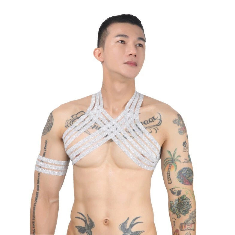 a sexy man in silver Men’s The Lewk Chest Harness Set – pridevoyageshop.com – gay men’s harness, lingerie and fetish wear