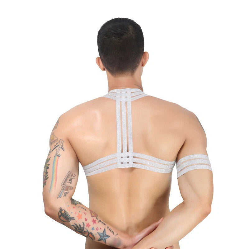 a sexy man in silver Men’s The Lewk Chest Harness Set – pridevoyageshop.com – gay men’s harness, lingerie and fetish wear