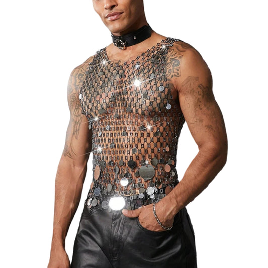 a sexy man in silver coinmail tank with metal discs draping over chest, showing sculpted torso and chain-style shimmer – pridevoyageshop.com – gay men’s harness, lingerie and fetish wear
