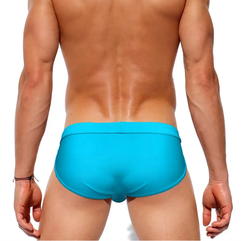 a sexy man in sky blue Men’s Clean Slate Swim Briefs - pridevoyageshop.com - gay men’s sexy swim briefs, trunks, board shorts, and bikinis