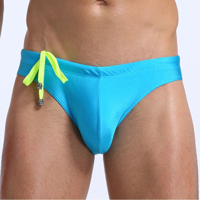 a sexy man in sky blue Men's Killer Bulge Swim Brief - pridevoyageshop.com - gay men’s sexy swim briefs, trunks, board shorts, and bikinis