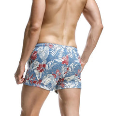 a sexy man in sky blue Men’s Tap-Ready Tides Swim Beach Surf Shorts – pridevoyageshop.com – gay men’s sexy swim briefs, trunks, board shorts, and bikinis