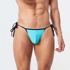 a sexy man in sky blue Men’s Werk It Tie-Up Swim Bikini Thong – pridevoyageshop.com – gay men’s sexy swim briefs, trunks, board shorts, and bikinis