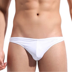 a sexy man in white DESMIIT Men’s Candy Drop Micro Bikini Swim Briefs - pridevoyageshop.com - gay men’s sexy swim briefs, trunks, board shorts, and bikinis