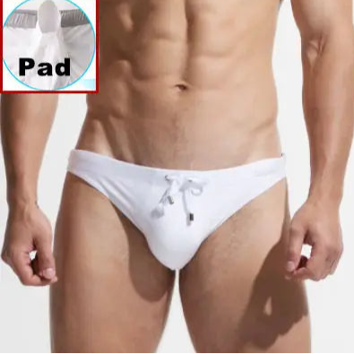 a sexy man in white Desmiit Men’s After Hours Aquatics Briefs with pad - pridevoyageshop.com - gay men’s sexy swim briefs, trunks, board shorts, and bikinis