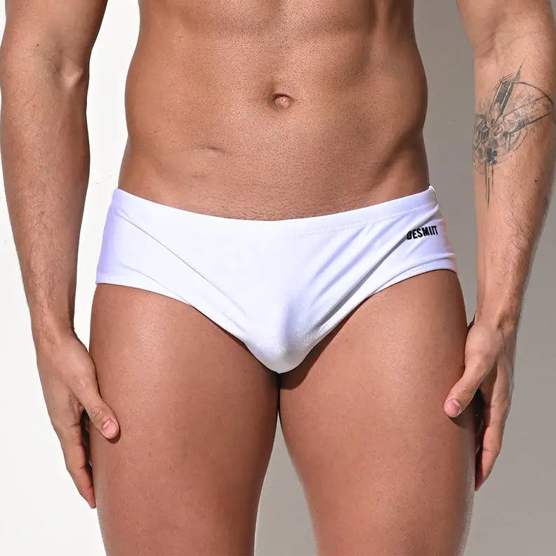 a sexy man in white Desmiit Men’s Pouch Devil Low Rise Swim Briefs - pridevoyageshop.com - gay men’s sexy swim briefs, trunks, board shorts, and bikinis
