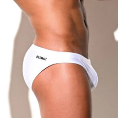 a sexy man in white Desmiit Men’s Trophy Cut Swim Briefs - pridevoyageshop.com - gay men’s sexy swim briefs, trunks, board shorts, and bikinis