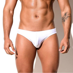 a sexy man in white Desmiit Men’s Trophy Cut Swim Briefs - pridevoyageshop.com - gay men’s sexy swim briefs, trunks, board shorts, and bikinis