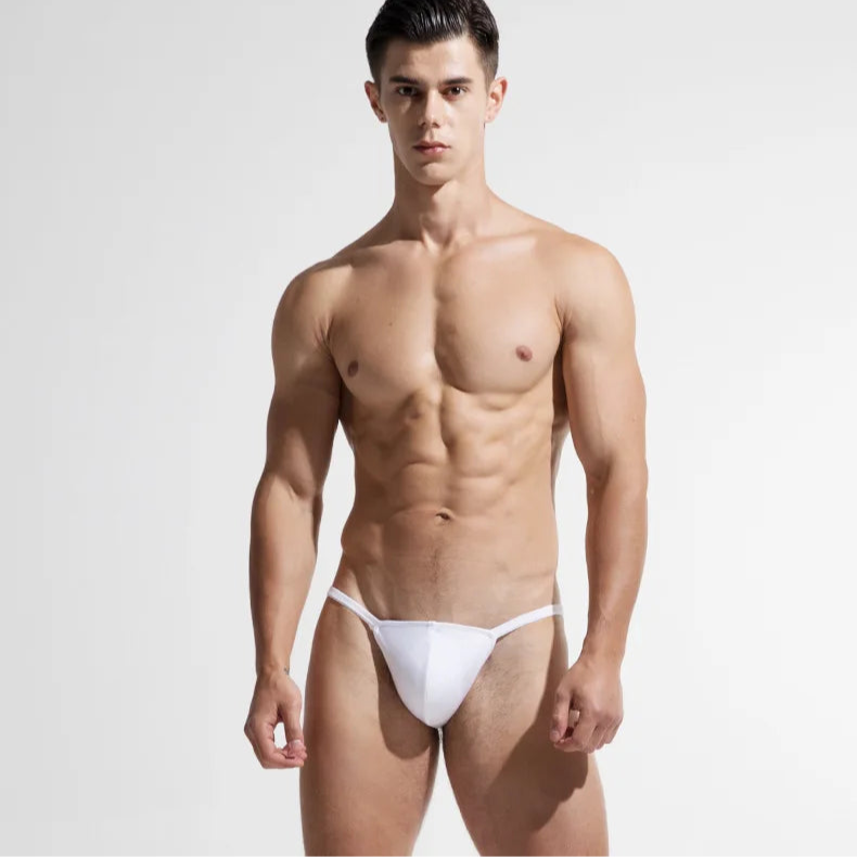 a sexy man in white Men’s Barely Legal Micro Thong Swim Briefs - pridevoyageshop.com - gay men’s sexy swim briefs, trunks, board shorts, and bikinis