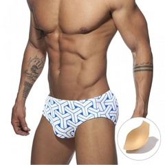 a sexy man in white Men’s Brickhouse Booty Swim Briefs with pad - pridevoyageshop.com - gay men’s sexy swim briefs, trunks, board shorts, and bikinis