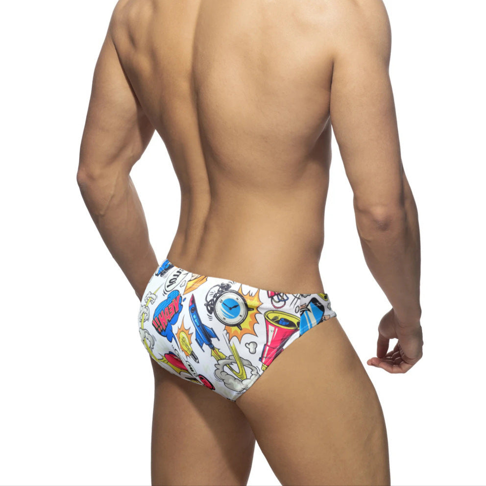a sexy man in white Men’s Comic Crotch Swim Briefs - pridevoyageshop.com - gay men’s sexy swim briefs, trunks, board shorts, and bikinis