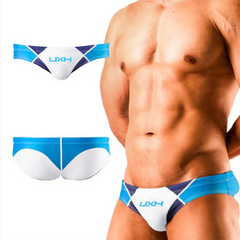 a sexy man in white Men’s Halftime Hard-On Swim Briefs - pridevoyageshop.com - gay men’s sexy swim briefs, trunks, board shorts, and bikinis