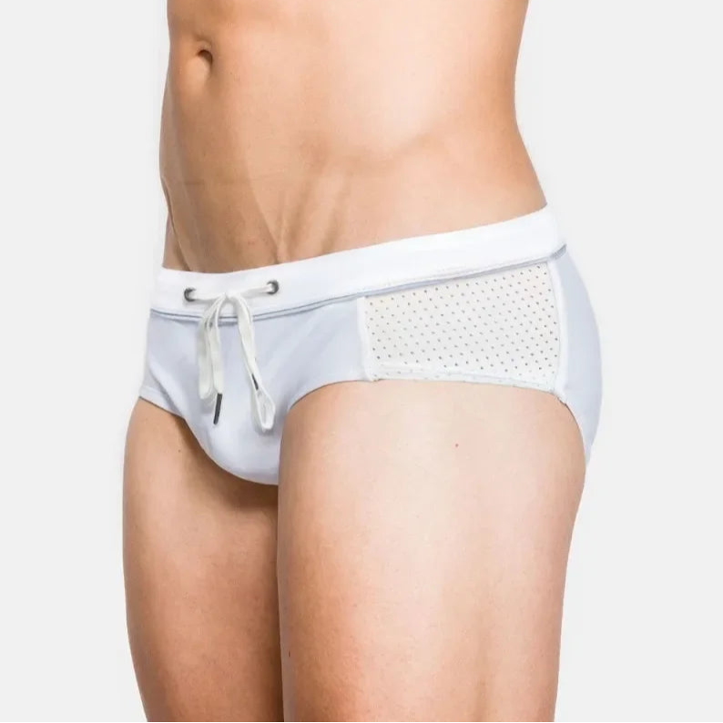 a sexy man in white Men’s Hole Patrol Side Mesh Swim Briefs - pridevoyageshop.com - gay men’s sexy swim briefs, trunks, board shorts, and bikinis